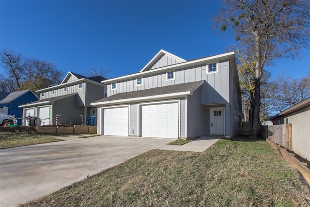 view of front of home featuring a garage and a front lawn