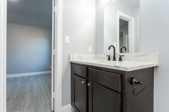 bathroom featuring vanity and hardwood / wood-style floors