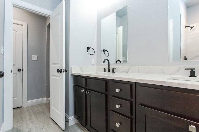 bathroom featuring hardwood / wood-style flooring and vanity