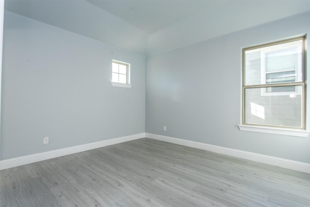 empty room with light hardwood / wood-style flooring