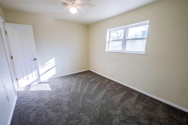 spare room with ceiling fan and carpet flooring