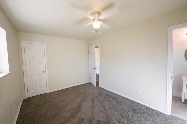 unfurnished bedroom with ceiling fan and carpet flooring