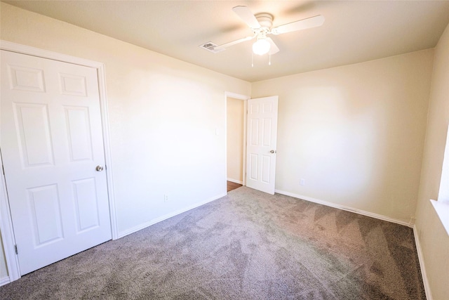 carpeted empty room with ceiling fan