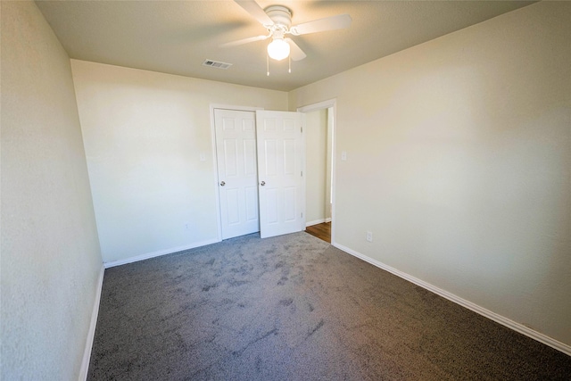 carpeted empty room with ceiling fan