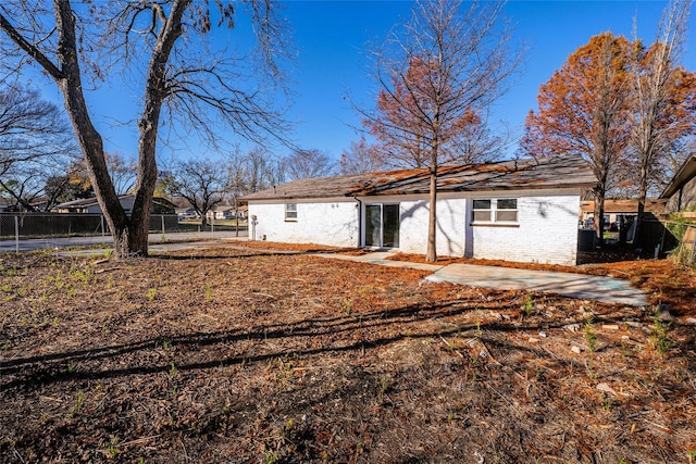 rear view of property featuring a patio area