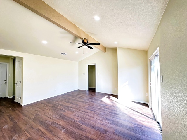 spare room featuring lofted ceiling with beams, ceiling fan, a textured ceiling, and dark hardwood / wood-style flooring