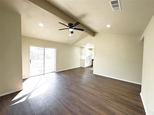 unfurnished living room with ceiling fan, vaulted ceiling with beams, a textured ceiling, and dark hardwood / wood-style flooring