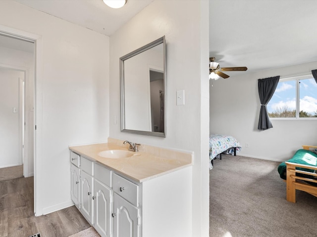 bathroom featuring ceiling fan and vanity