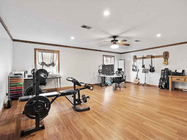 exercise area with plenty of natural light and light hardwood / wood-style flooring