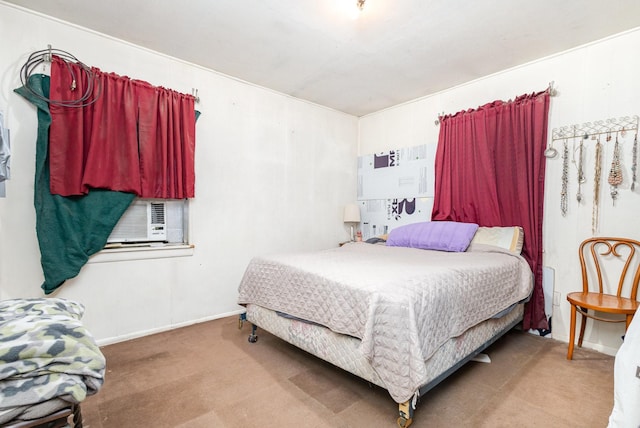 bedroom featuring cooling unit, carpet floors, and baseboards