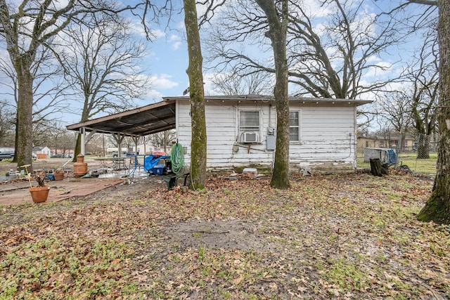 view of side of home featuring a patio and fence