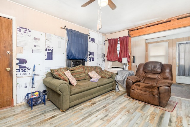 living area featuring ceiling fan and wood finished floors