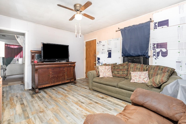 living area with light wood-type flooring and ceiling fan