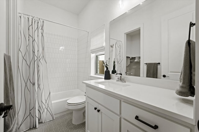 bathroom featuring toilet, shower / bath combo with shower curtain, and vanity