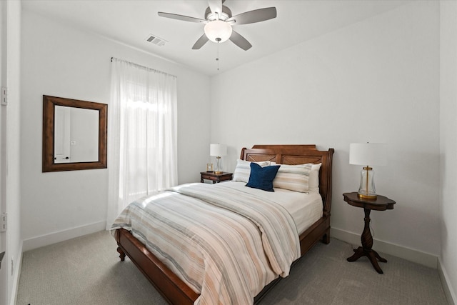 carpeted bedroom with visible vents, ceiling fan, and baseboards