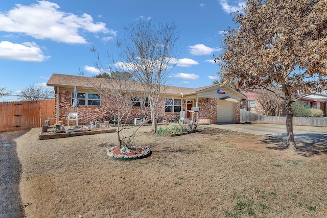 ranch-style home featuring concrete driveway, brick siding, fence, and an attached garage