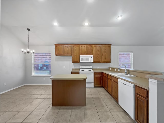 kitchen with pendant lighting, sink, white appliances, and light tile patterned flooring