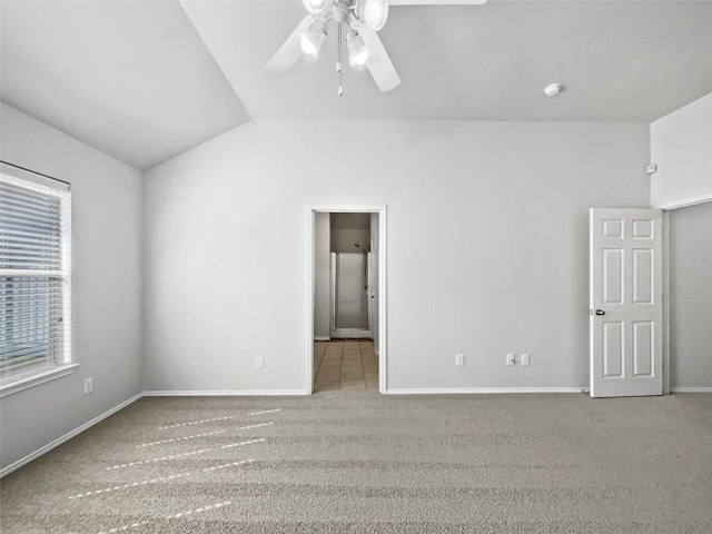 unfurnished bedroom with lofted ceiling, light carpet, and ceiling fan