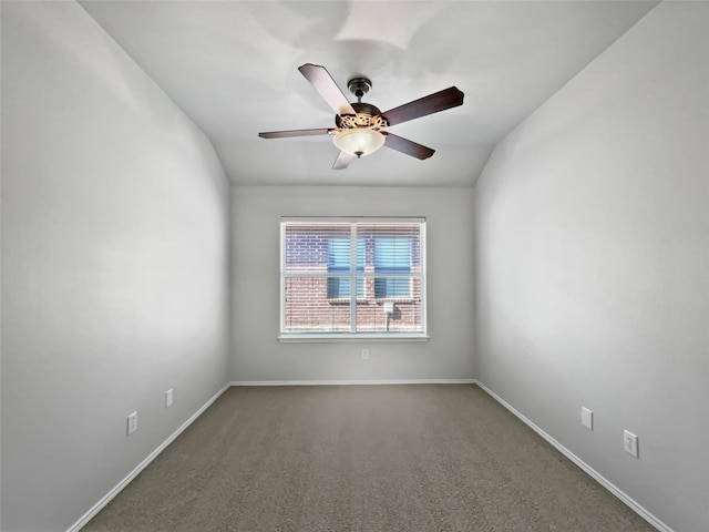 carpeted empty room with ceiling fan and lofted ceiling