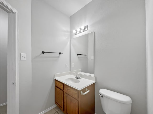 bathroom with vanity, tile patterned floors, and toilet