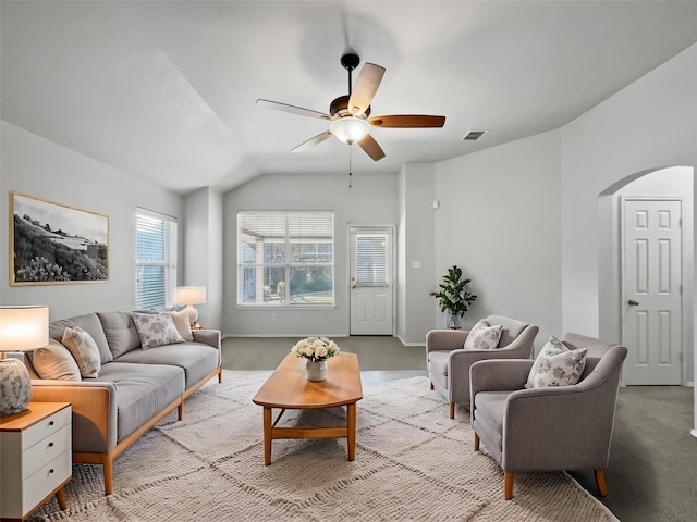 living room with light colored carpet, ceiling fan, and vaulted ceiling