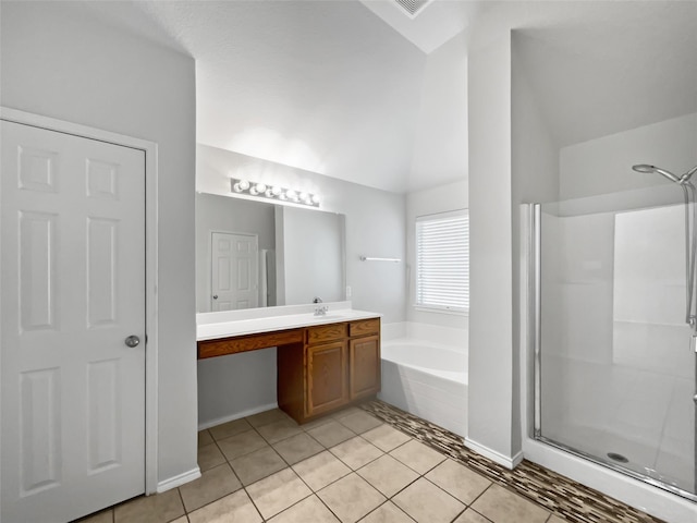 bathroom featuring tile patterned flooring, shower with separate bathtub, lofted ceiling, and vanity