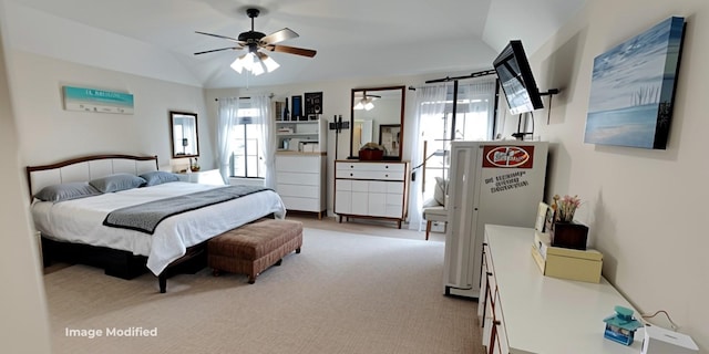 bedroom featuring vaulted ceiling, light colored carpet, and ceiling fan