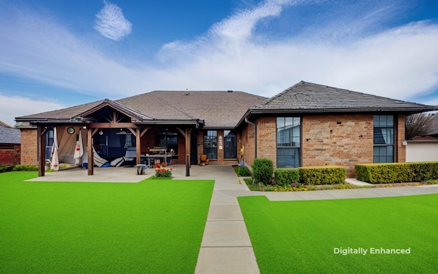 back of house featuring a patio and a yard