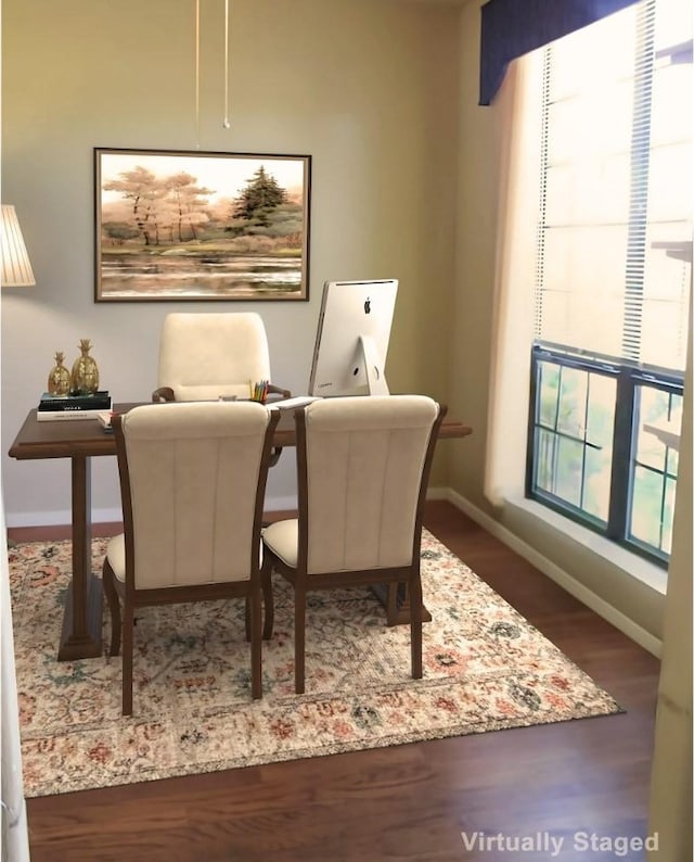 dining area featuring dark wood-type flooring