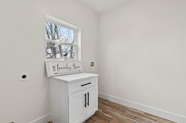 laundry room with baseboards, washer hookup, cabinet space, hookup for an electric dryer, and dark wood-style flooring