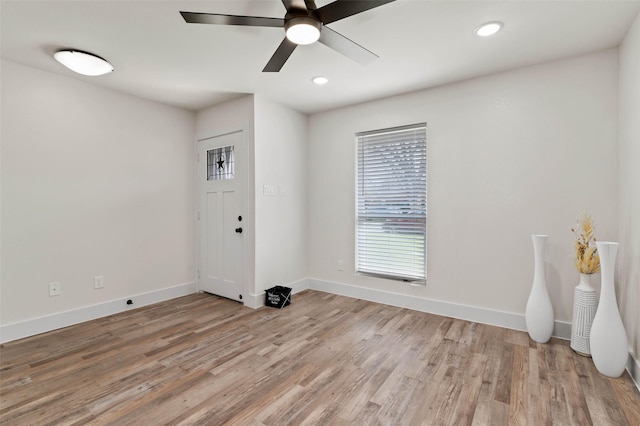 unfurnished room with recessed lighting, baseboards, light wood-style flooring, and ceiling fan