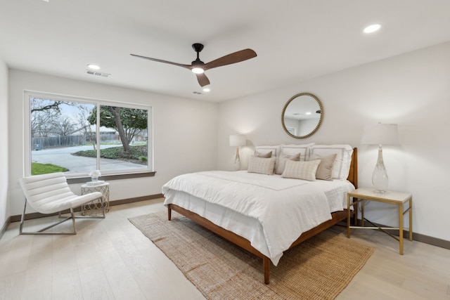 bedroom with ceiling fan and light wood-type flooring