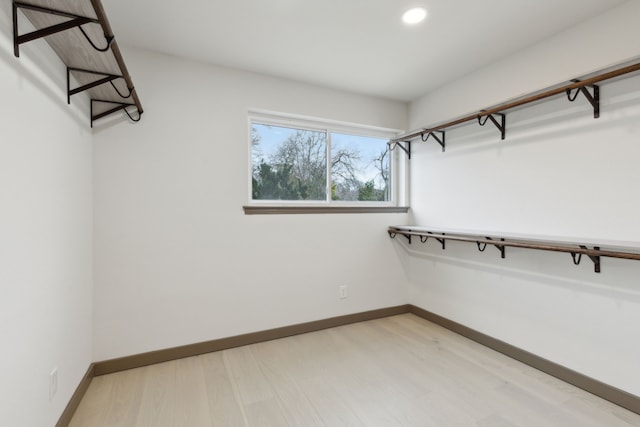 spacious closet featuring hardwood / wood-style floors