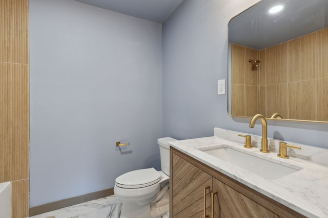 bathroom featuring vanity, a shower, and toilet