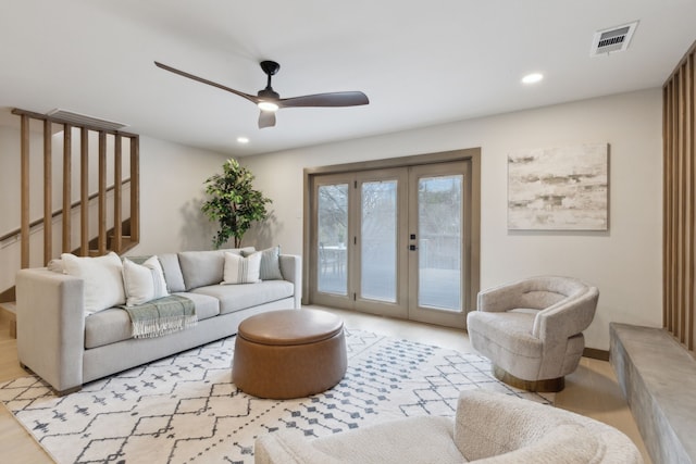 living room with french doors and ceiling fan