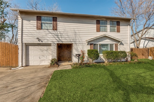 view of front facade featuring a garage and a front lawn