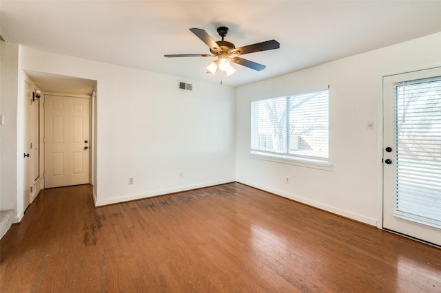 empty room with ceiling fan and wood-type flooring