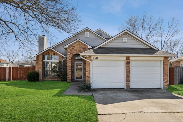 view of front of house featuring a garage and a front yard