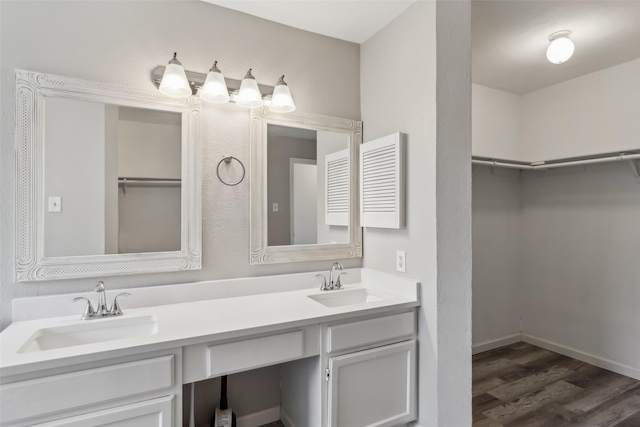 bathroom featuring vanity and wood-type flooring