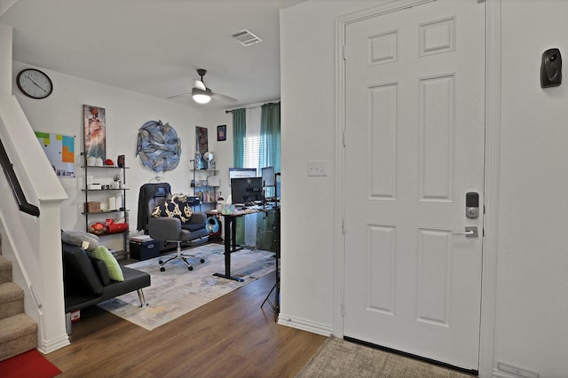 interior space featuring hardwood / wood-style floors and ceiling fan