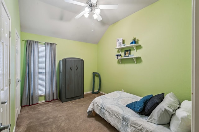 carpeted bedroom with vaulted ceiling and ceiling fan