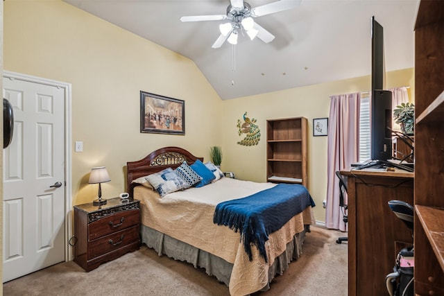 bedroom with ceiling fan, light colored carpet, and vaulted ceiling