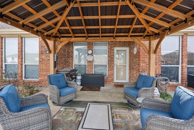 view of patio / terrace featuring an outdoor living space and a gazebo