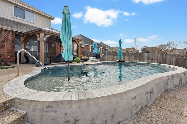 view of pool featuring a patio area, fence, and a fenced in pool