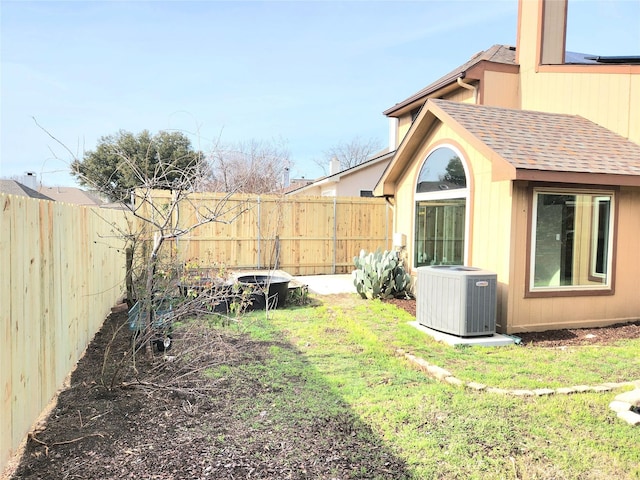 view of yard featuring central AC unit