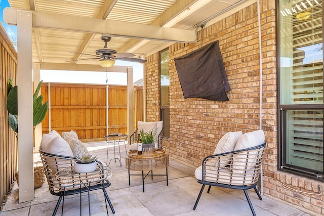 view of patio featuring ceiling fan