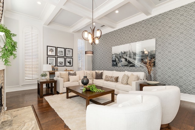 living room with coffered ceiling, hardwood / wood-style floors, beam ceiling, and an inviting chandelier