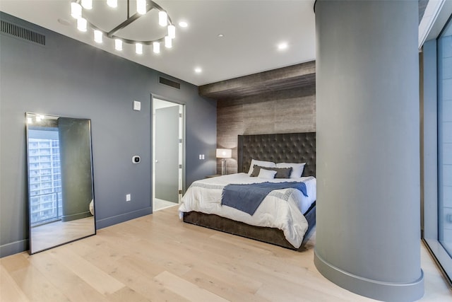 bedroom with light hardwood / wood-style flooring