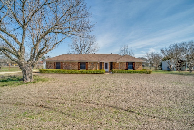 ranch-style house with a front yard