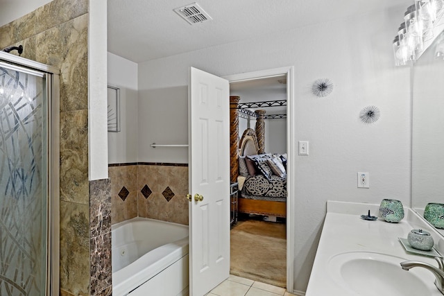 2312 Bantry Ln, Arlington, TX 76002 - ensuite bathroom featuring a jetted tub, tile patterned floors, and vanity
